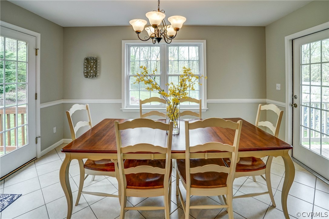 2855 Red Lane Road Powhatan, VA 23139 - Photo 14 of 42 a view of a dining room with furniture and a chandelier