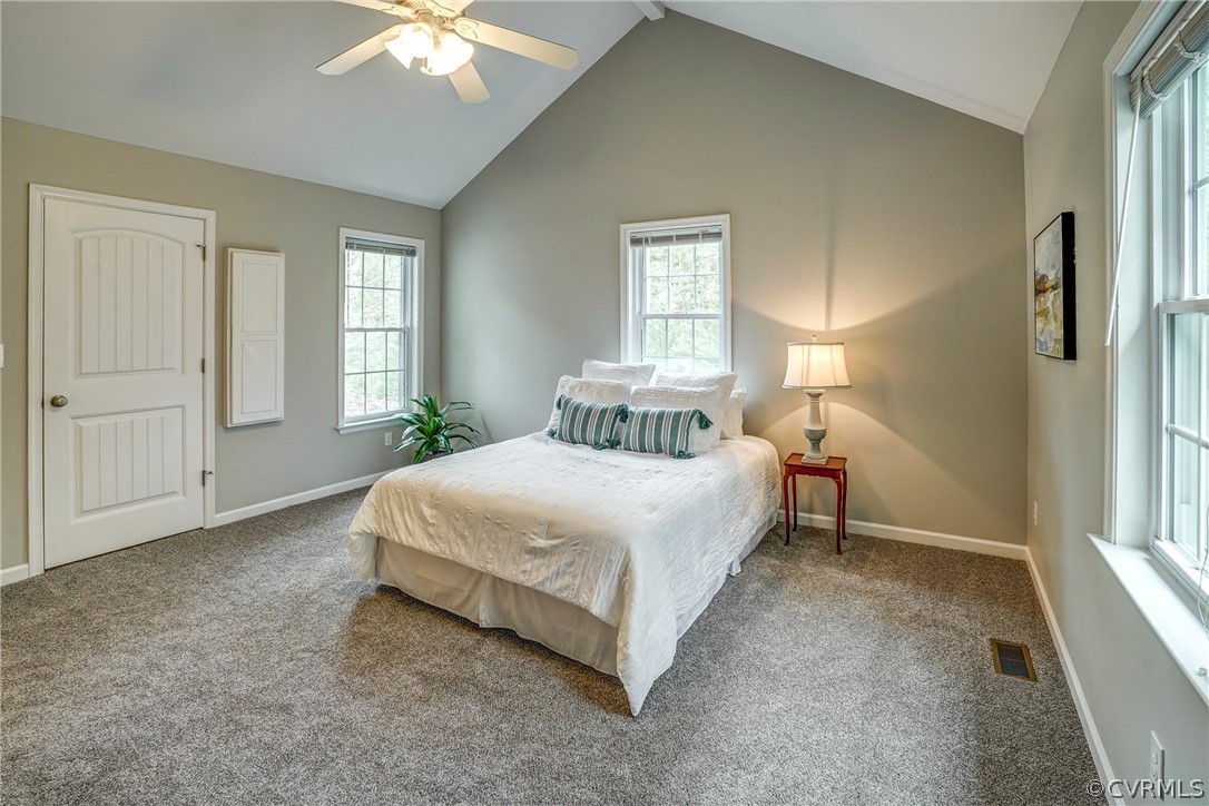 2855 Red Lane Road Powhatan, VA 23139 - Photo 17 of 42 a spacious bedroom with a bed and a window