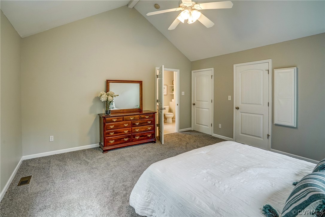 2855 Red Lane Road Powhatan, VA 23139 - Photo 18 of 42 a bedroom with a bed and a chandelier