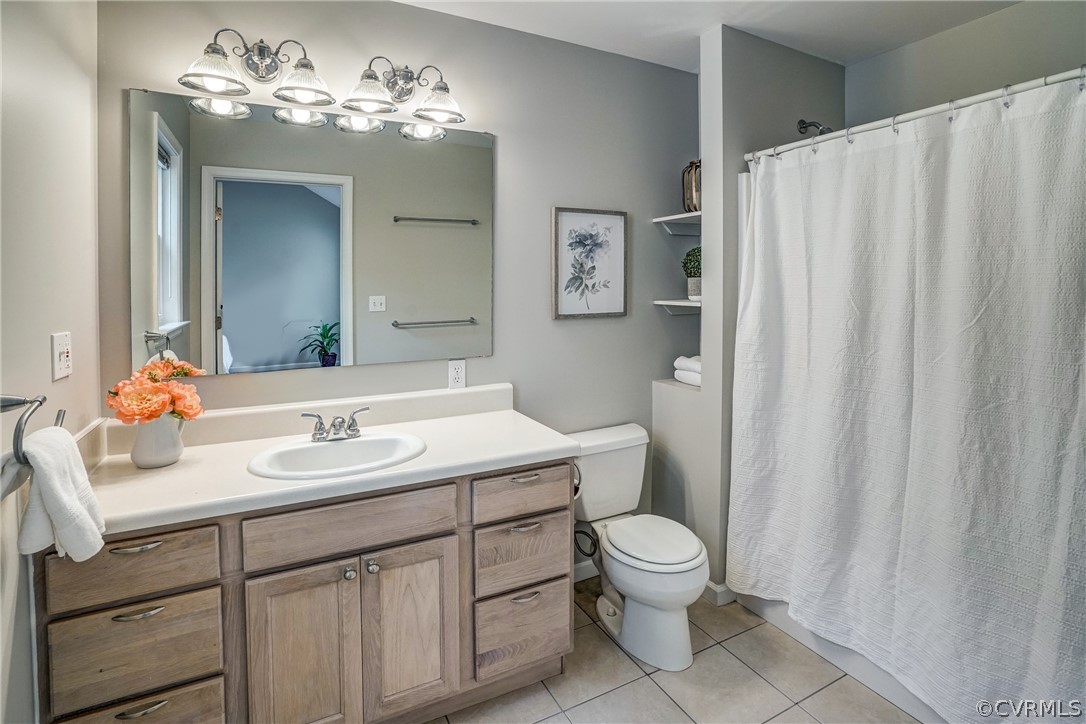 2855 Red Lane Road Powhatan, VA 23139 - Photo 20 of 42 a bathroom with a toilet sink and mirror