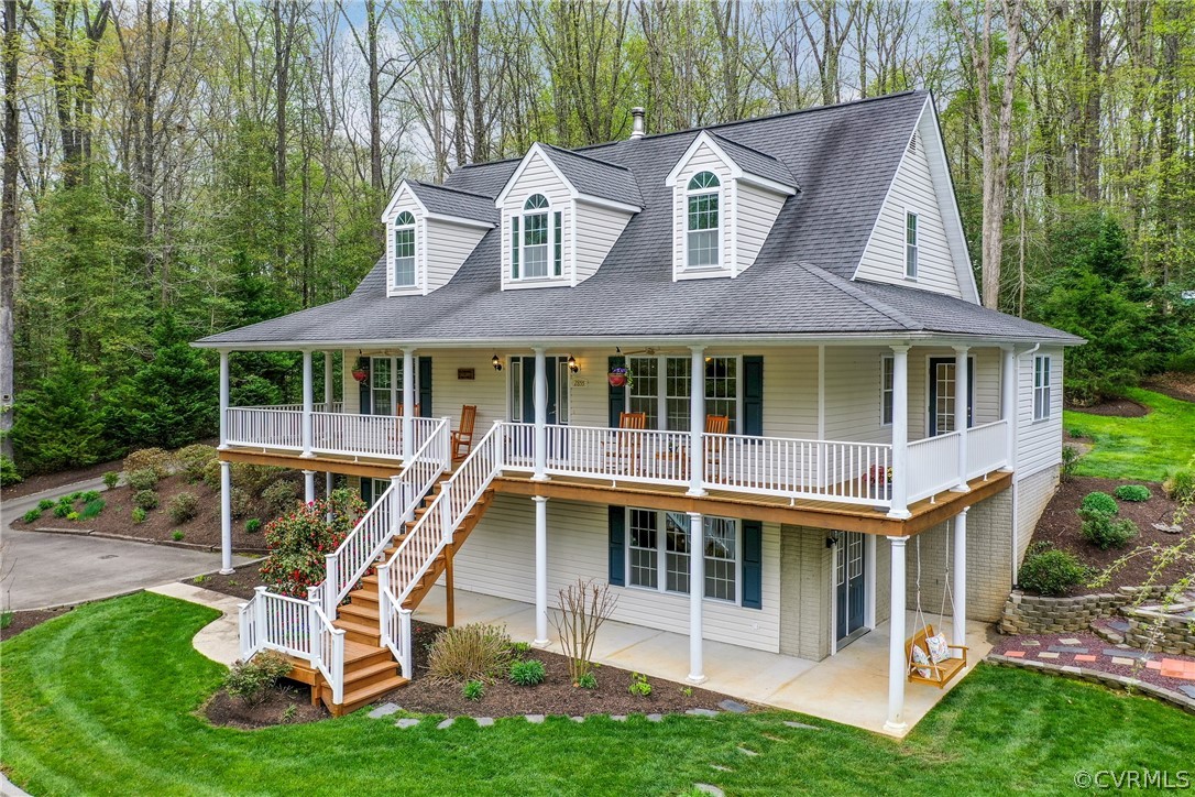 2855 Red Lane Road Powhatan, VA 23139 - Photo 2 of 42 a view of a white house with a yard and sitting area
