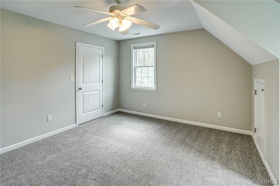 2855 Red Lane Road Powhatan, VA 23139 - Photo 31 of 42 an empty room with a window and a chandelier fan