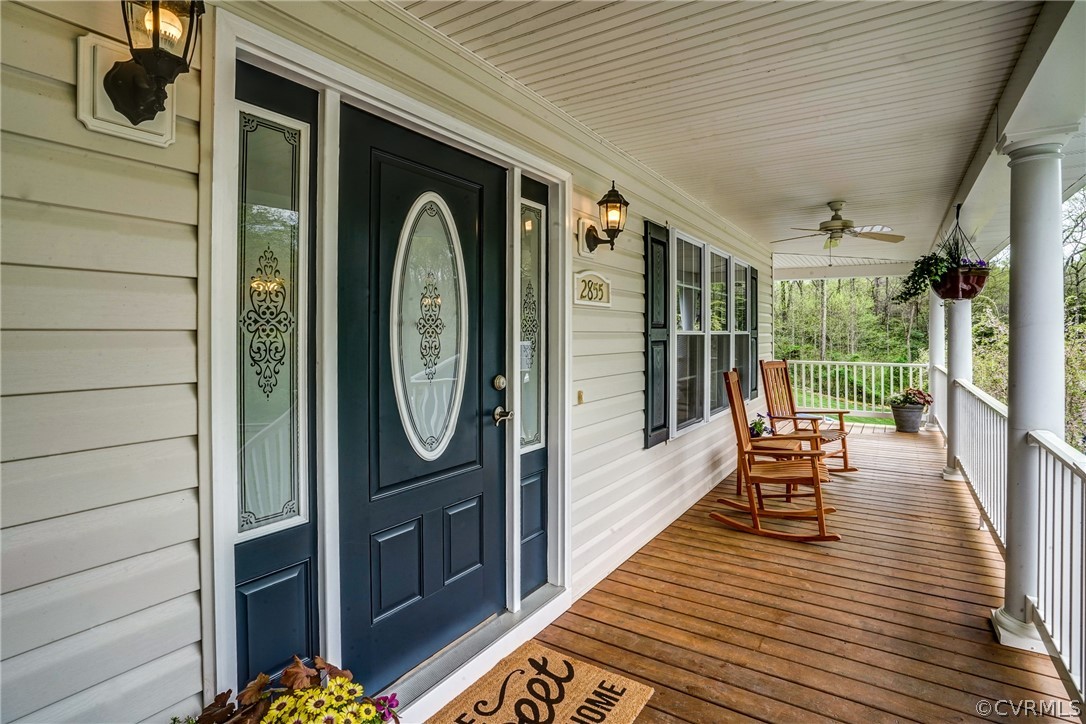 2855 Red Lane Road Powhatan, VA 23139 - Photo 5 of 42 a balcony with chairs and wooden floor