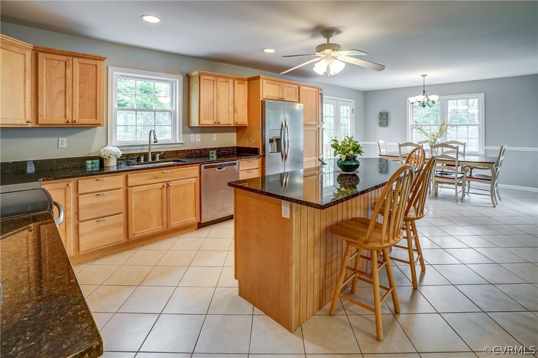 2855 Red Lane Road Powhatan, VA 23139 - Photo 10 of 42 a view of a kitchen with granite countertop a counter space dining table and stainless steel appliances