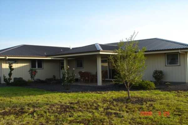 275 Akolea Road Hilo, HI 96720 - Photo 2 of 11 a front view of house with yard