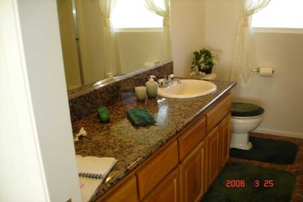 275 Akolea Road Hilo, HI 96720 - Photo 10 of 11 a bathroom with a sink and toilet