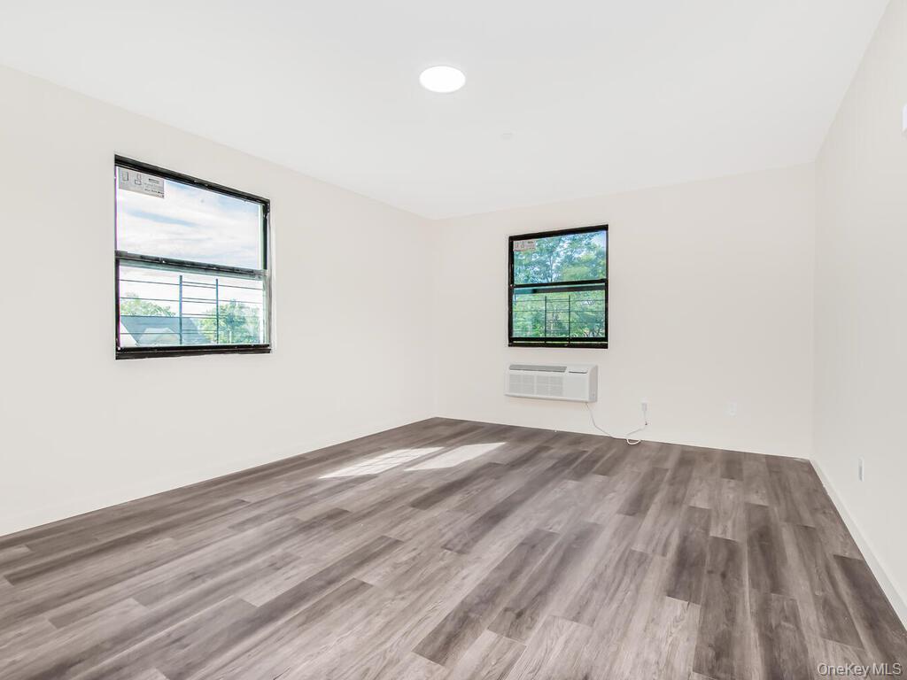 409 Warburton Avenue, Unit 5A Yonkers, NY 10701 - Photo 5 of 13 Unfurnished room with wood finished floors and recessed lighting