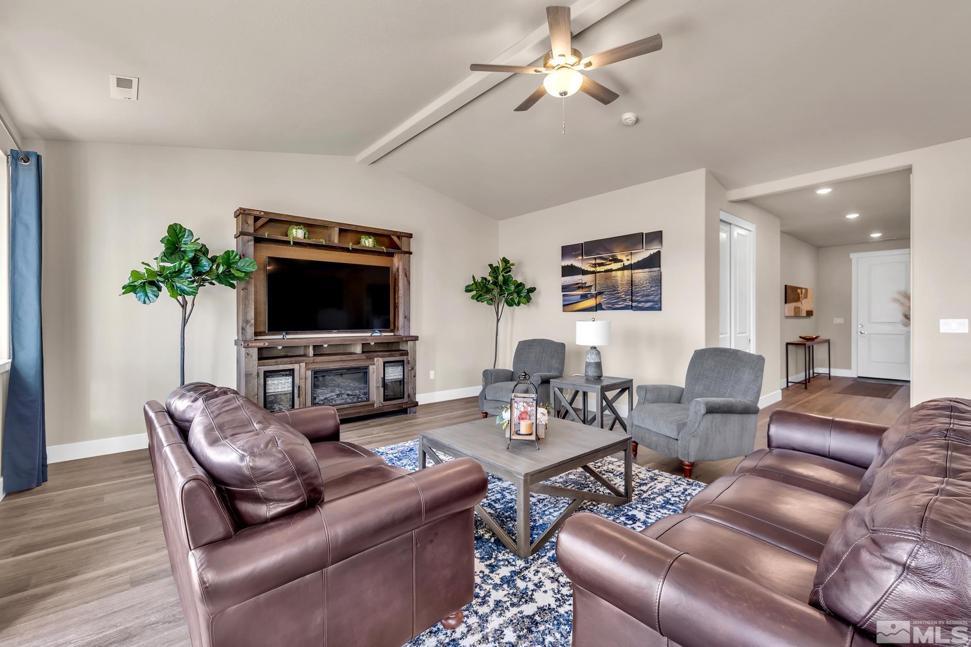 255 James Ranch Court Reno, NV 89510 - Photo 8 of 19 a living room with furniture and a flat screen tv