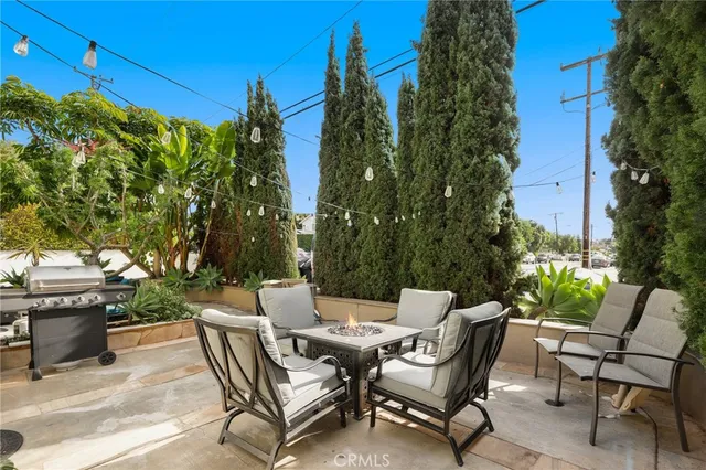 a view of a chairs and table in patio