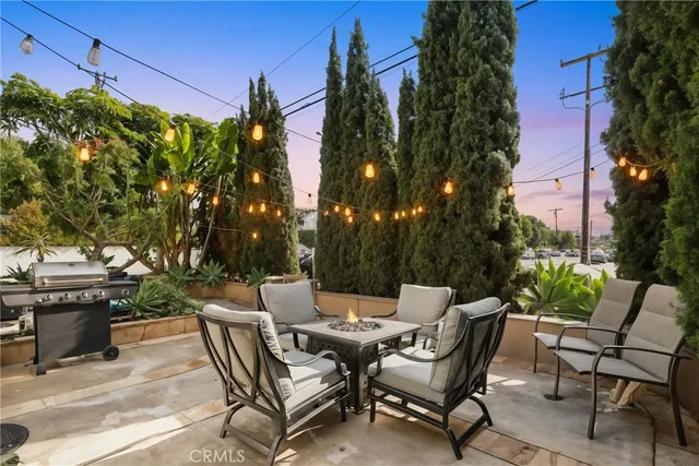 a view of a patio with table and chairs and potted plants