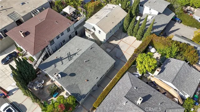 an aerial view of multiple houses with yard