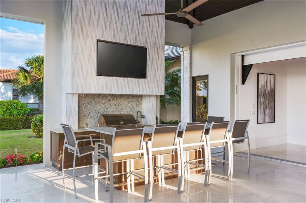 13851 Williston Way Naples, FL 34119 - Photo 35 of 50 a dinning table and chairs in the patio