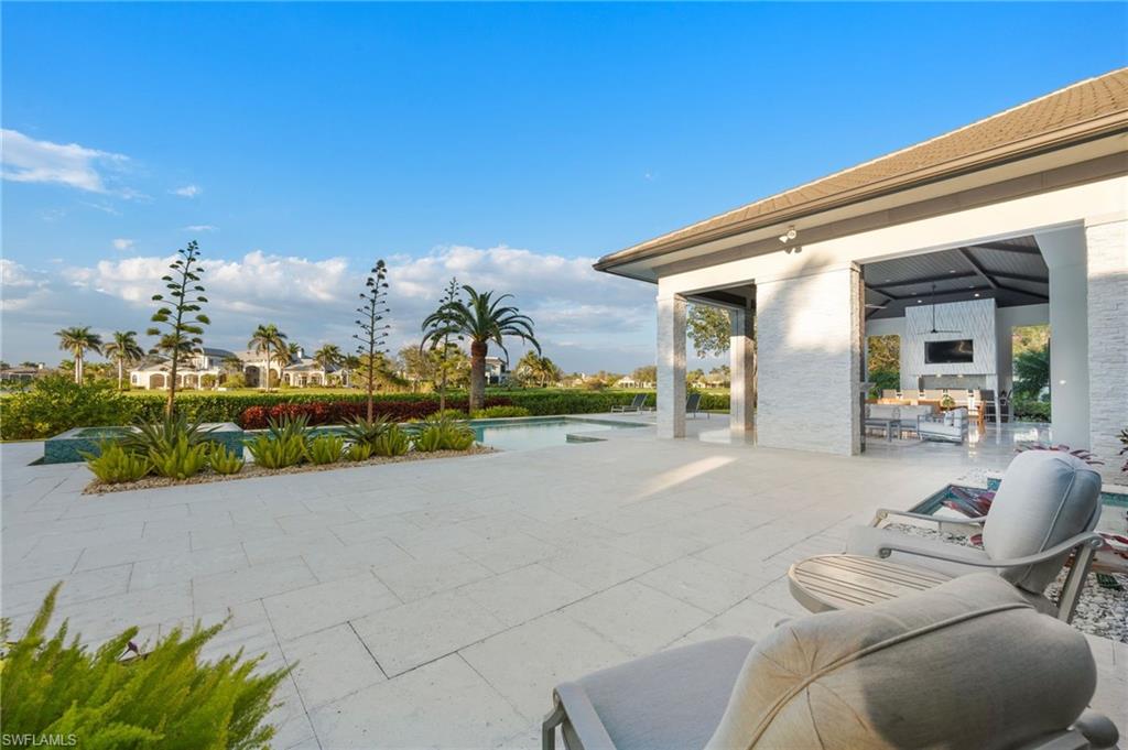 13851 Williston Way Naples, FL 34119 - Photo 44 of 50 a view of living room filled with furniture and chandelier