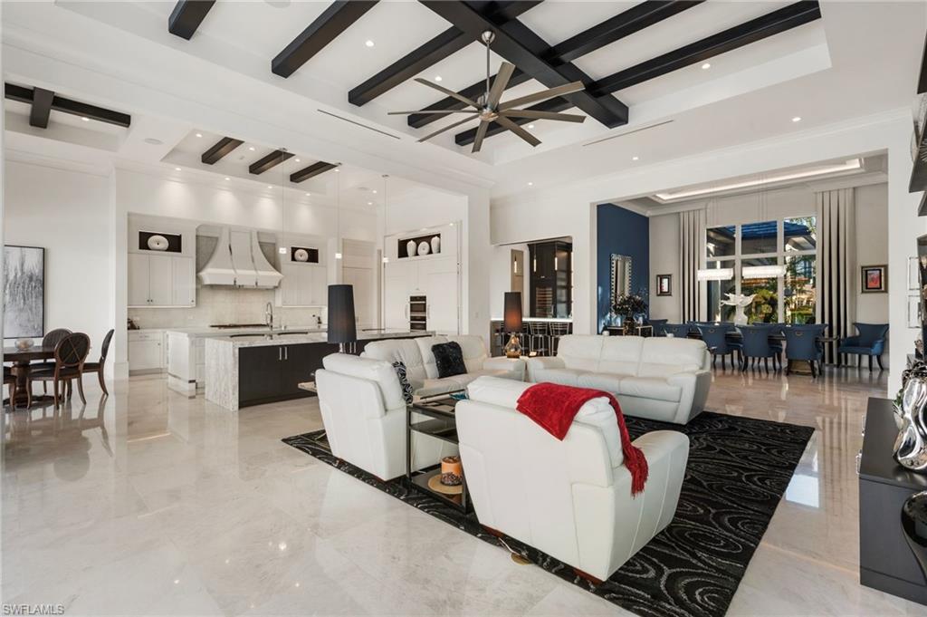 13851 Williston Way Naples, FL 34119 - Photo 8 of 50 a living room with furniture and a chandelier