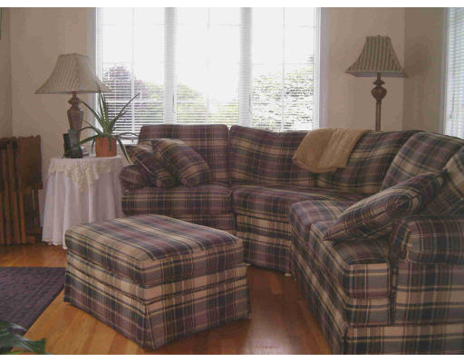 45 Gregory Road Wakefield, MA 01880 - Photo 8 of 10 a bed sitting in a bedroom next to a window