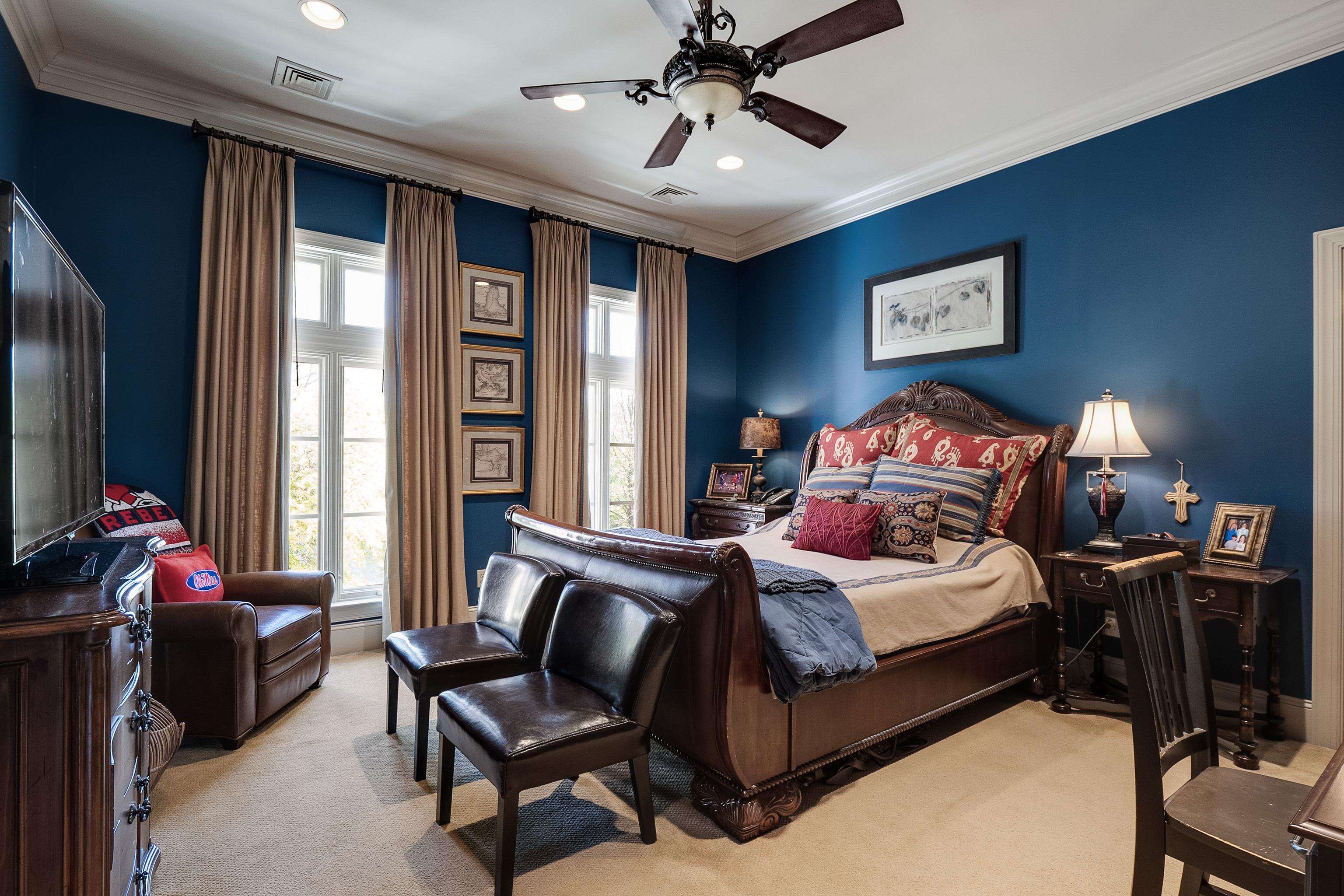 2000 Patrick Drive Corinth, MS 38834 - Photo 20 of 25 a bedroom with a bed and large windows