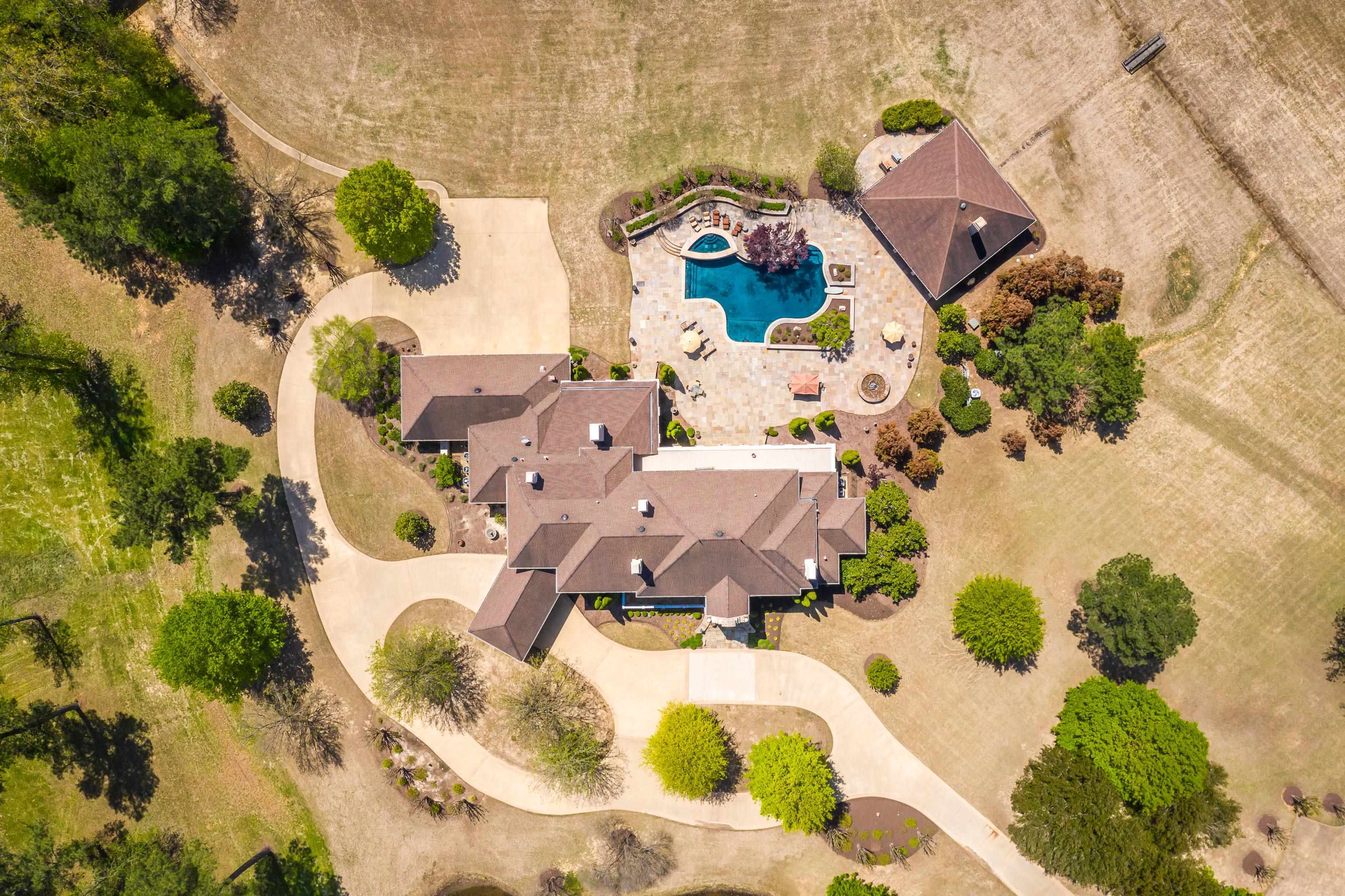2000 Patrick Drive Corinth, MS 38834 - Photo 2 of 25 an aerial view of a house with a yard and sitting area