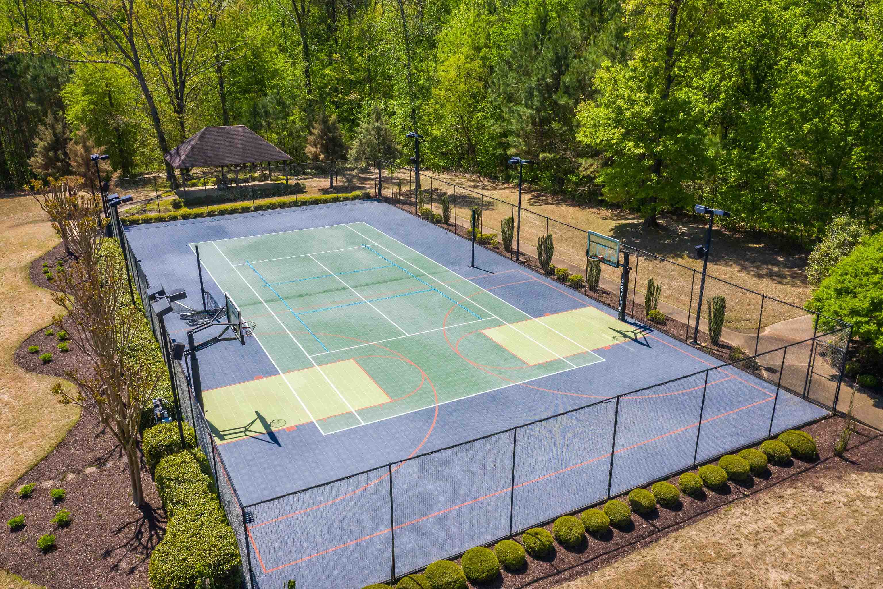 2000 Patrick Drive Corinth, MS 38834 - Photo 24 of 25 a view of a tennis ground with large trees