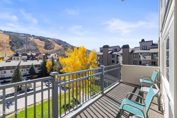 a view of a balcony with city view