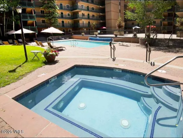 a view of swimming pool with chairs