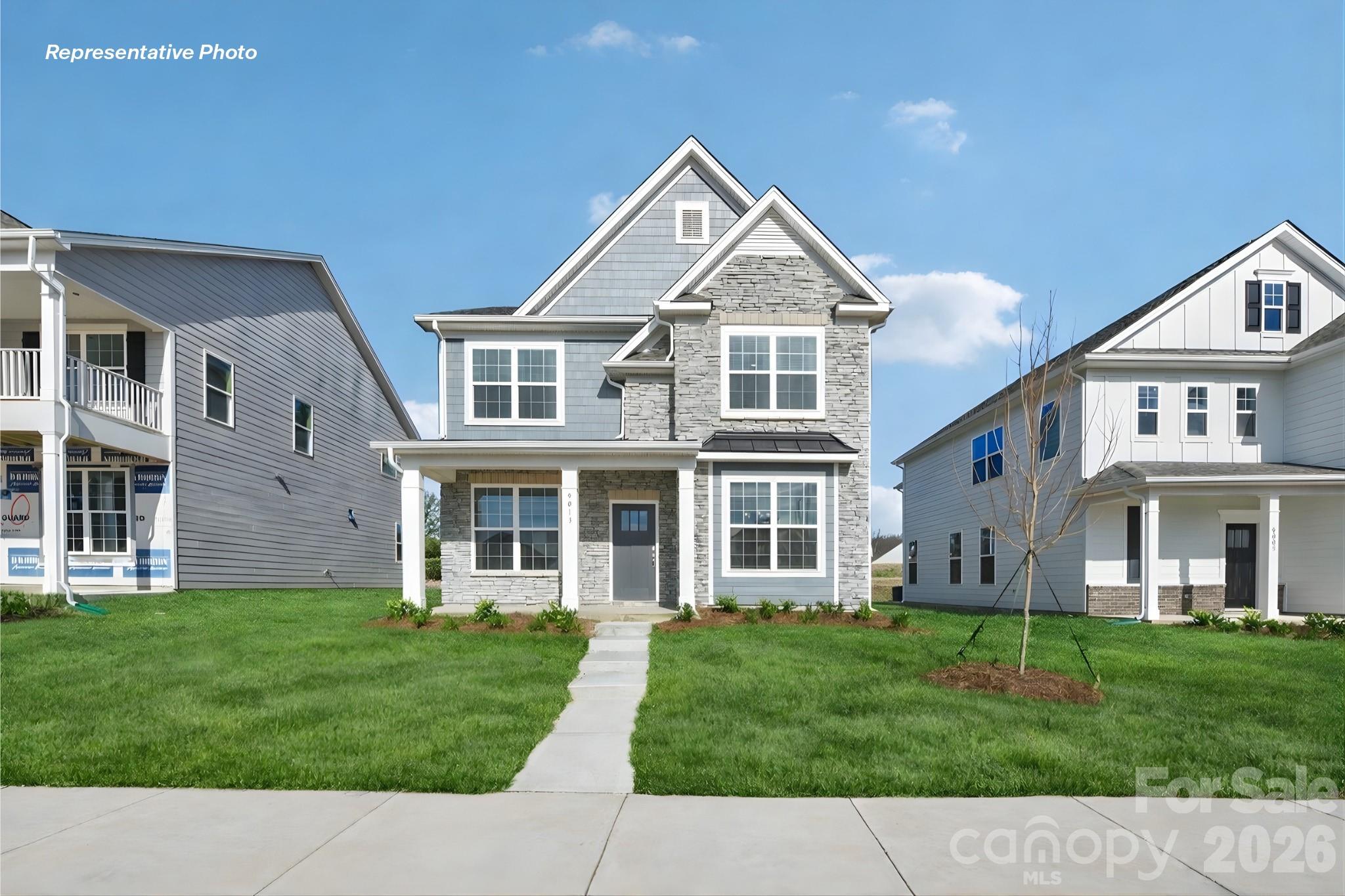 front view of a house with a yard