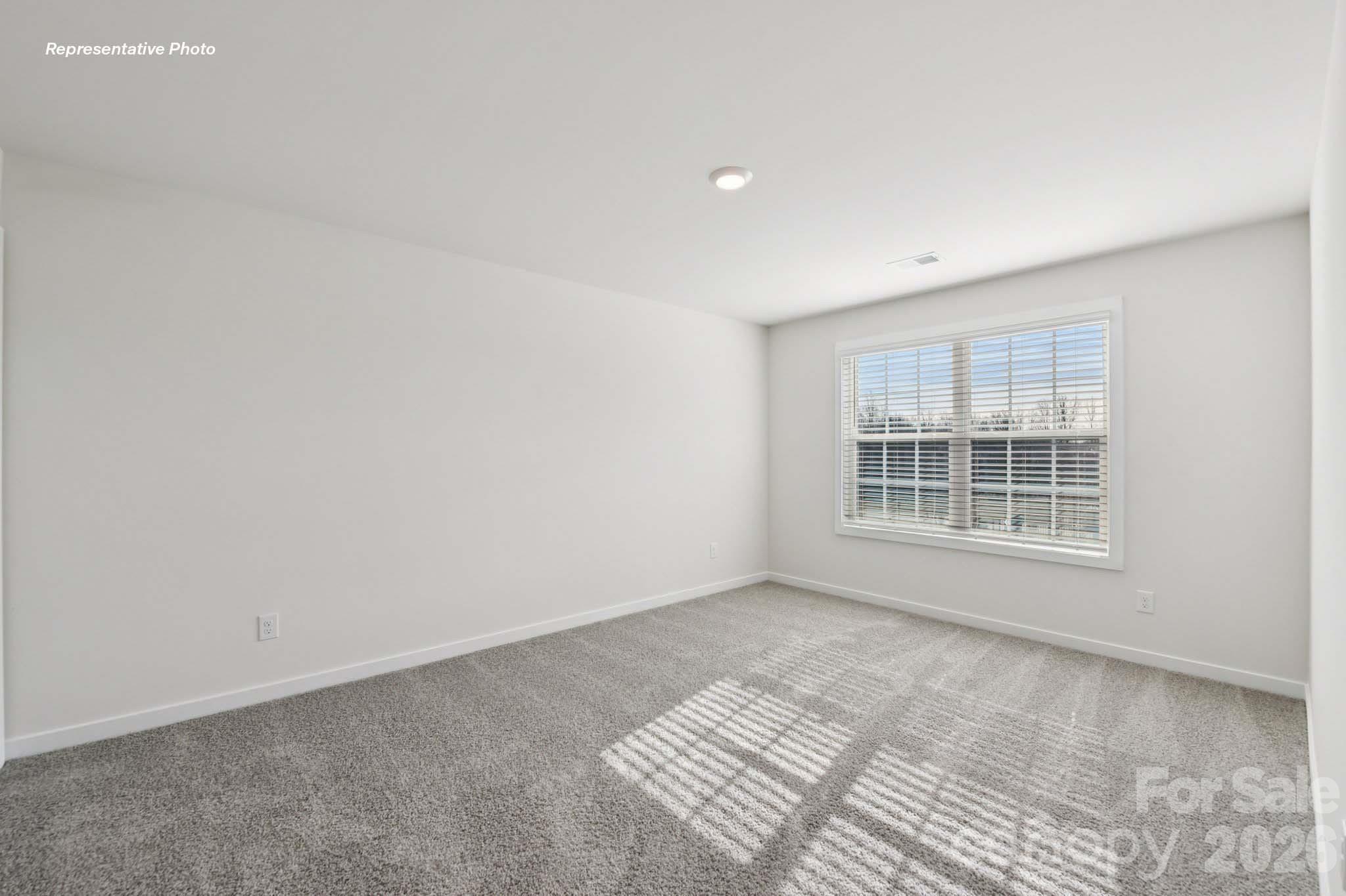 8905 Overhill Road Huntersville, NC 28078 - Photo 18 of 30 a view of an empty room with a window