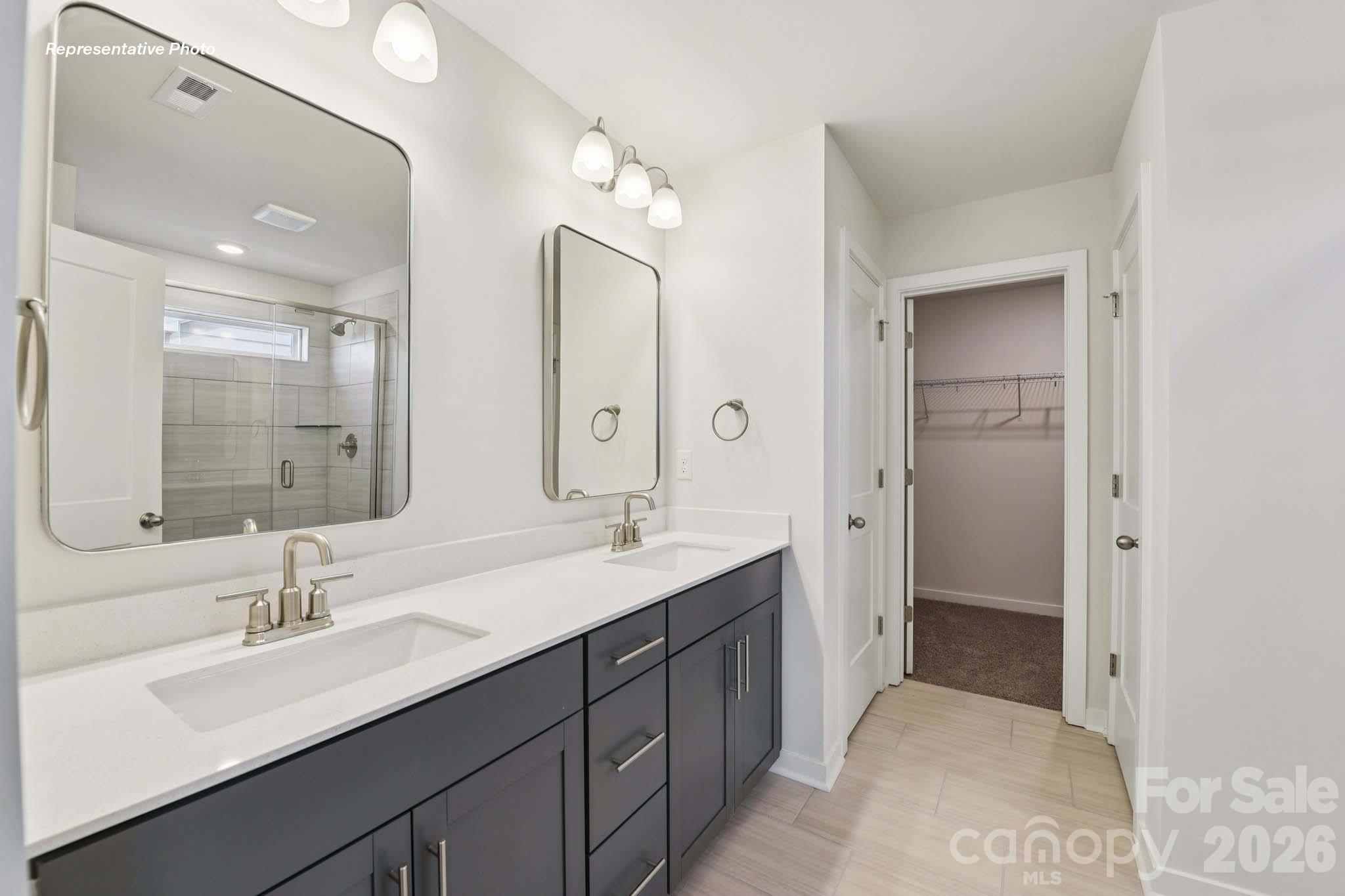8905 Overhill Road Huntersville, NC 28078 - Photo 30 of 30 a bathroom with a sink double vanity granite tub and shower