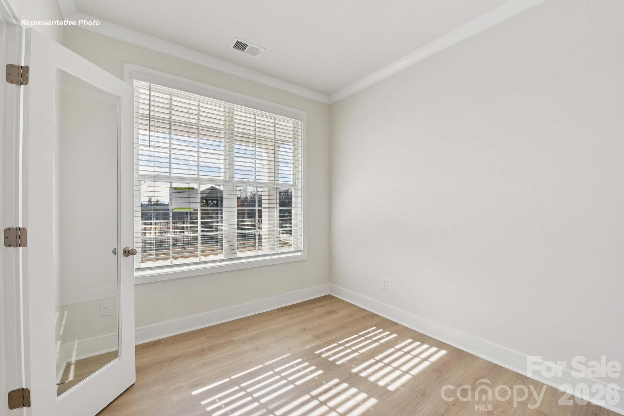 8905 Overhill Road Huntersville, NC 28078 - Photo 3 of 30 a view of an empty room with a window