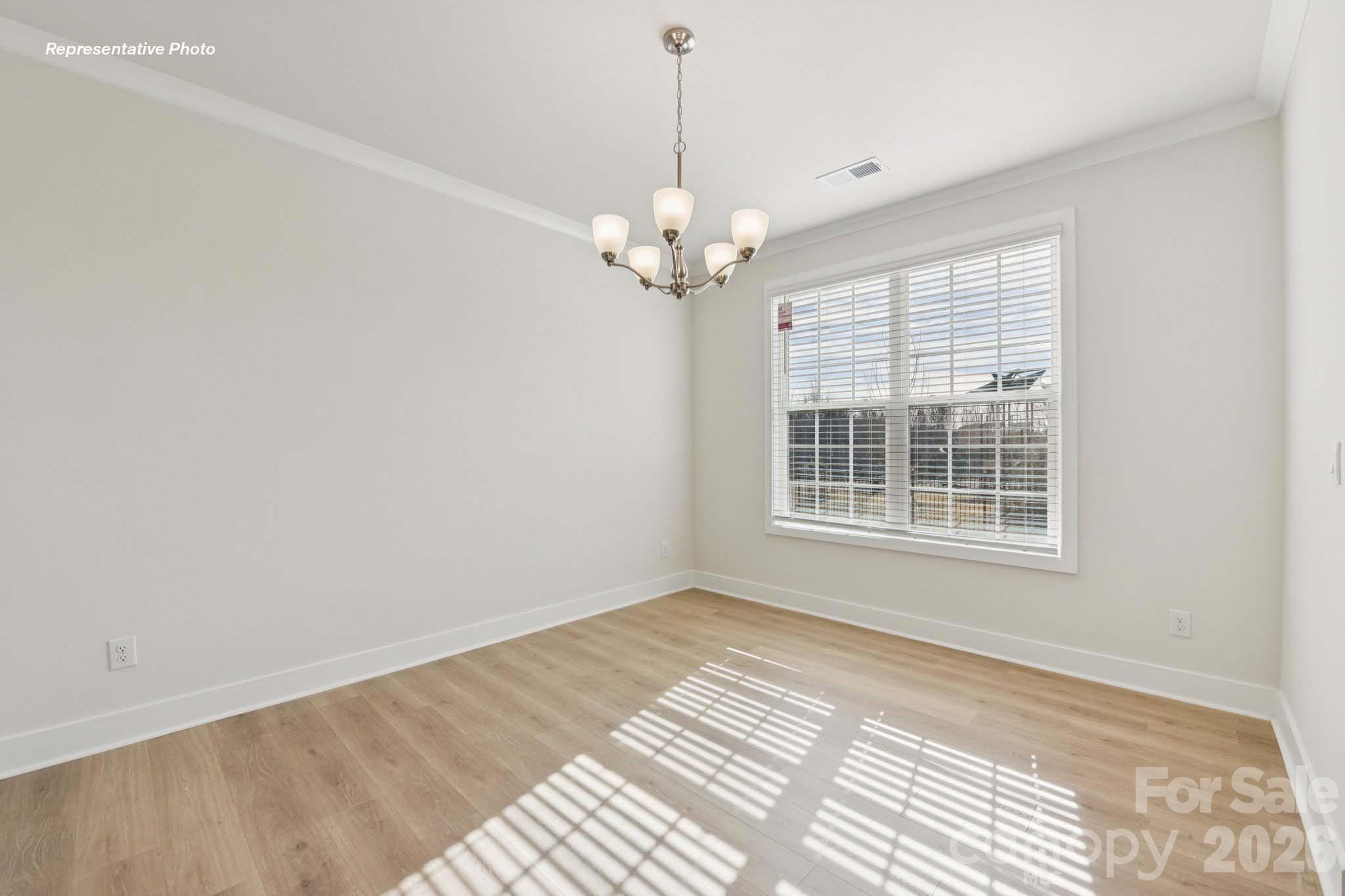 8905 Overhill Road Huntersville, NC 28078 - Photo 5 of 30 a view of an empty room with a window