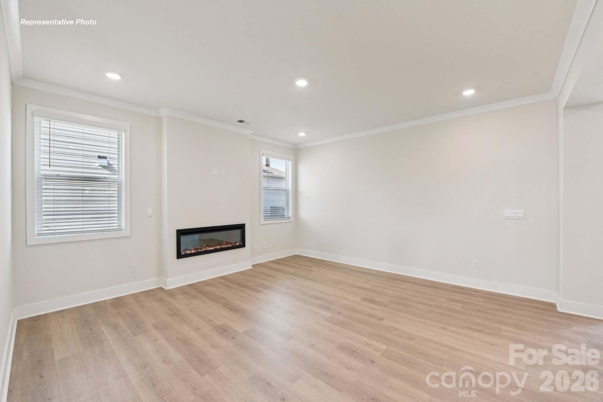 8905 Overhill Road Huntersville, NC 28078 - Photo 10 of 30 wooden floor in an empty room with a window