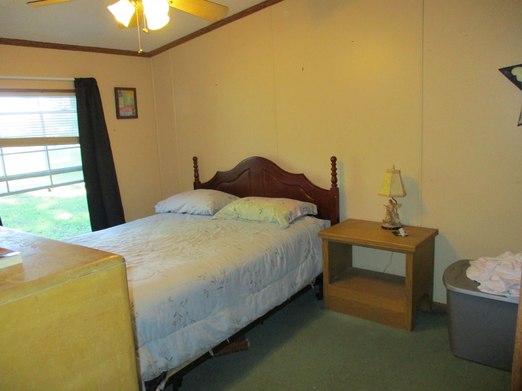 1112 Lecomte Road Dickson, TN 37055 - Photo 8 of 33 a bed sitting in a bedroom next to a window
