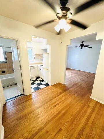 a view of a livingroom with wooden floor