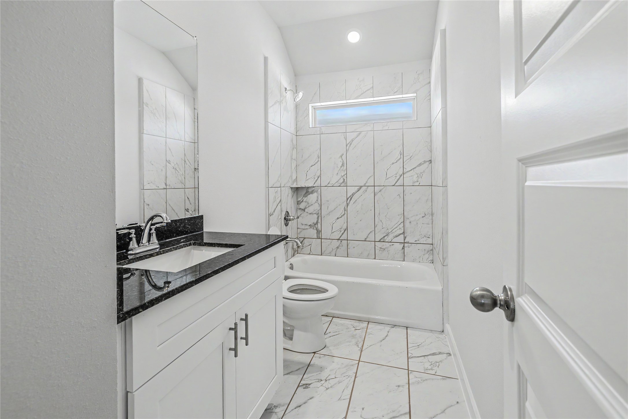 6426 Bolinas Court Rosharon, TX 77583 - Photo 37 of 49 a bathroom with a granite countertop sink a toilet and bathtub