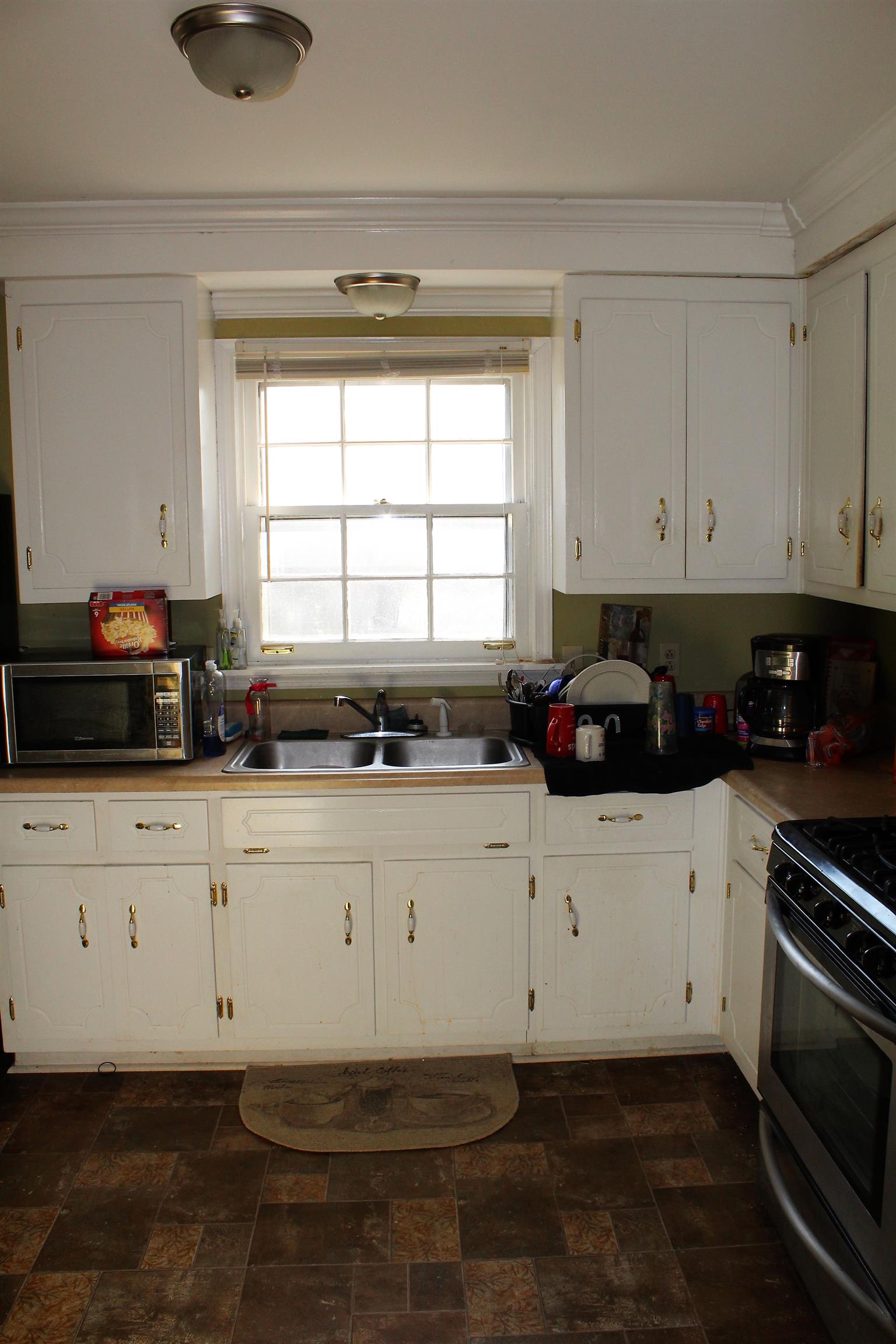 125 Jones Creek Road Dickson, TN 37055 - Photo 11 of 16 a kitchen with a white cabinets and appliances