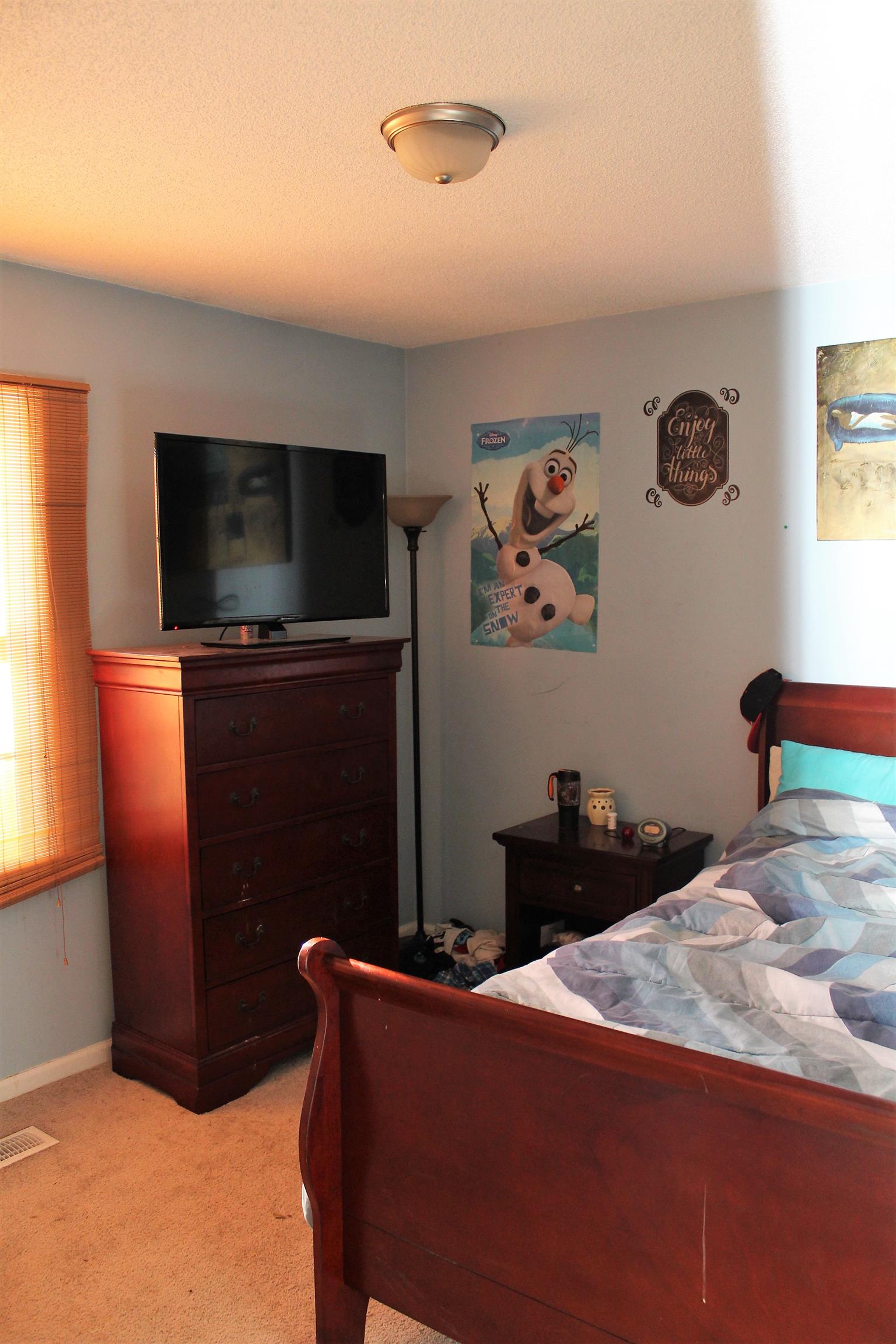 125 Jones Creek Road Dickson, TN 37055 - Photo 14 of 16 a bedroom with a bed and a flat screen tv