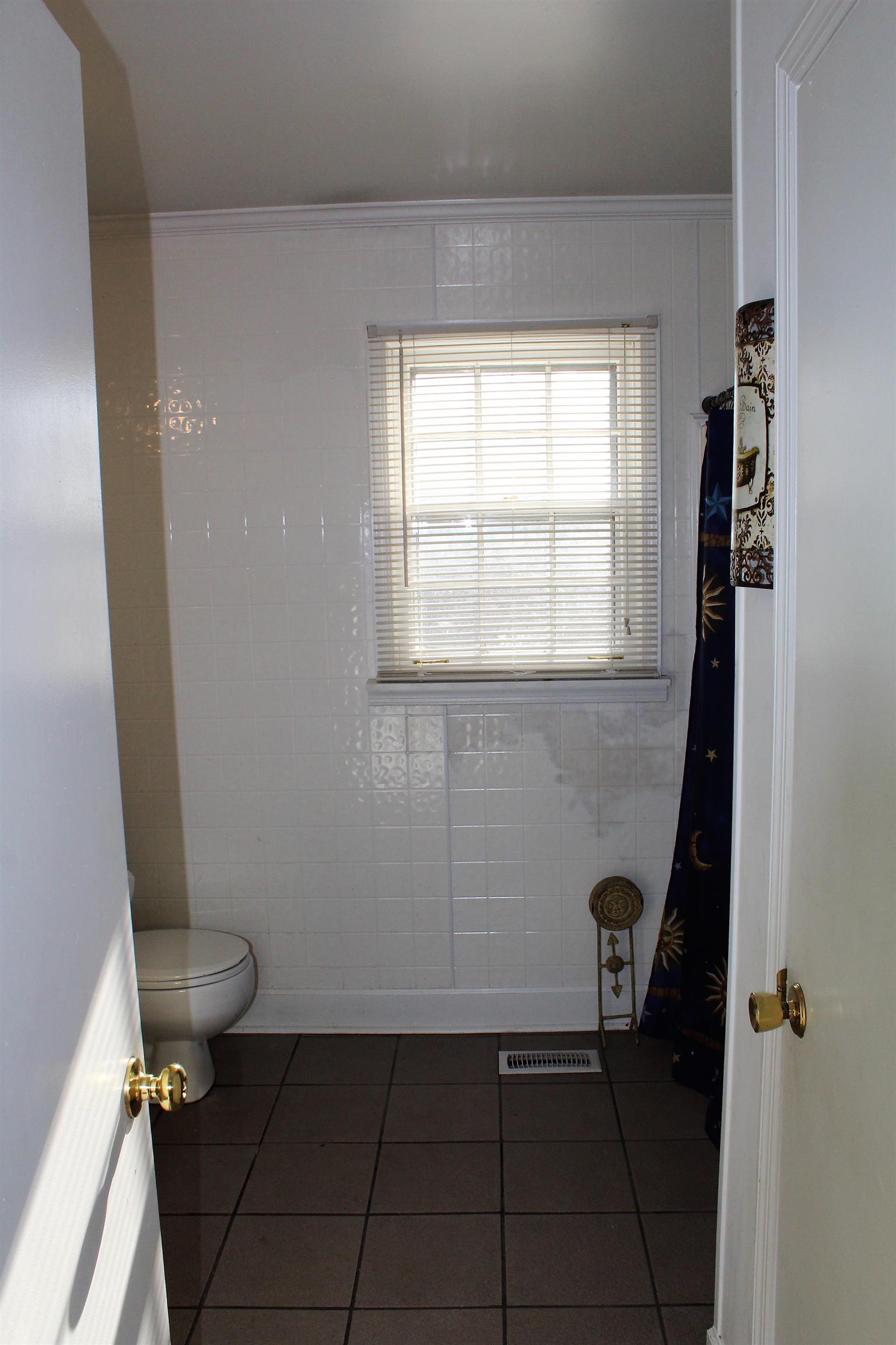 125 Jones Creek Road Dickson, TN 37055 - Photo 16 of 16 a bathroom with a sink and a toilet
