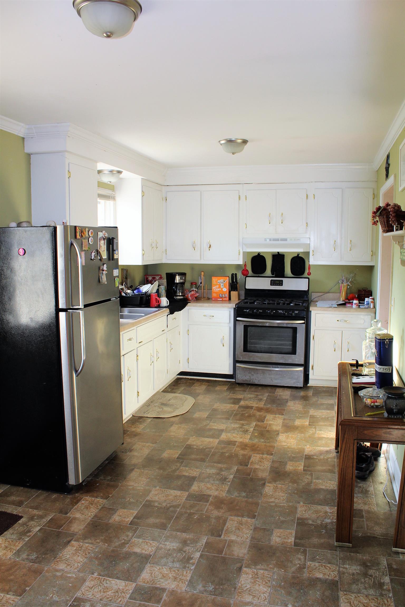 125 Jones Creek Road Dickson, TN 37055 - Photo 10 of 16 a kitchen with stainless steel appliances granite countertop a refrigerator a stove and a sink