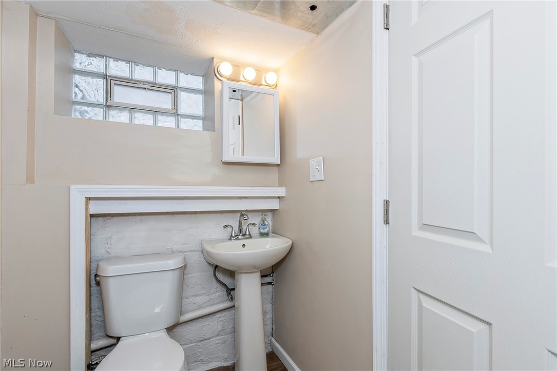 917 Brunswick Road Cleveland Heights, OH 44112 - Photo 37 of 42 Basement half bath with access to storage and utility closet.