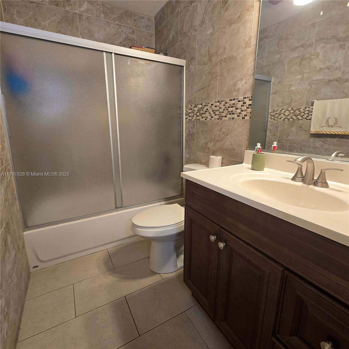 12900 Southwest 81st Street Miami, FL 33183 - Photo 11 of 19 a bathroom with a sink a toilet and shower