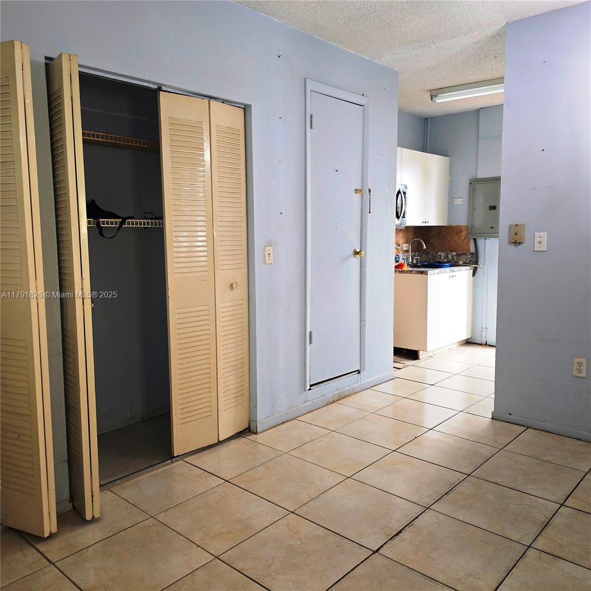 12900 Southwest 81st Street Miami, FL 33183 - Photo 15 of 19 a view of a storage & utility room and a kitchen