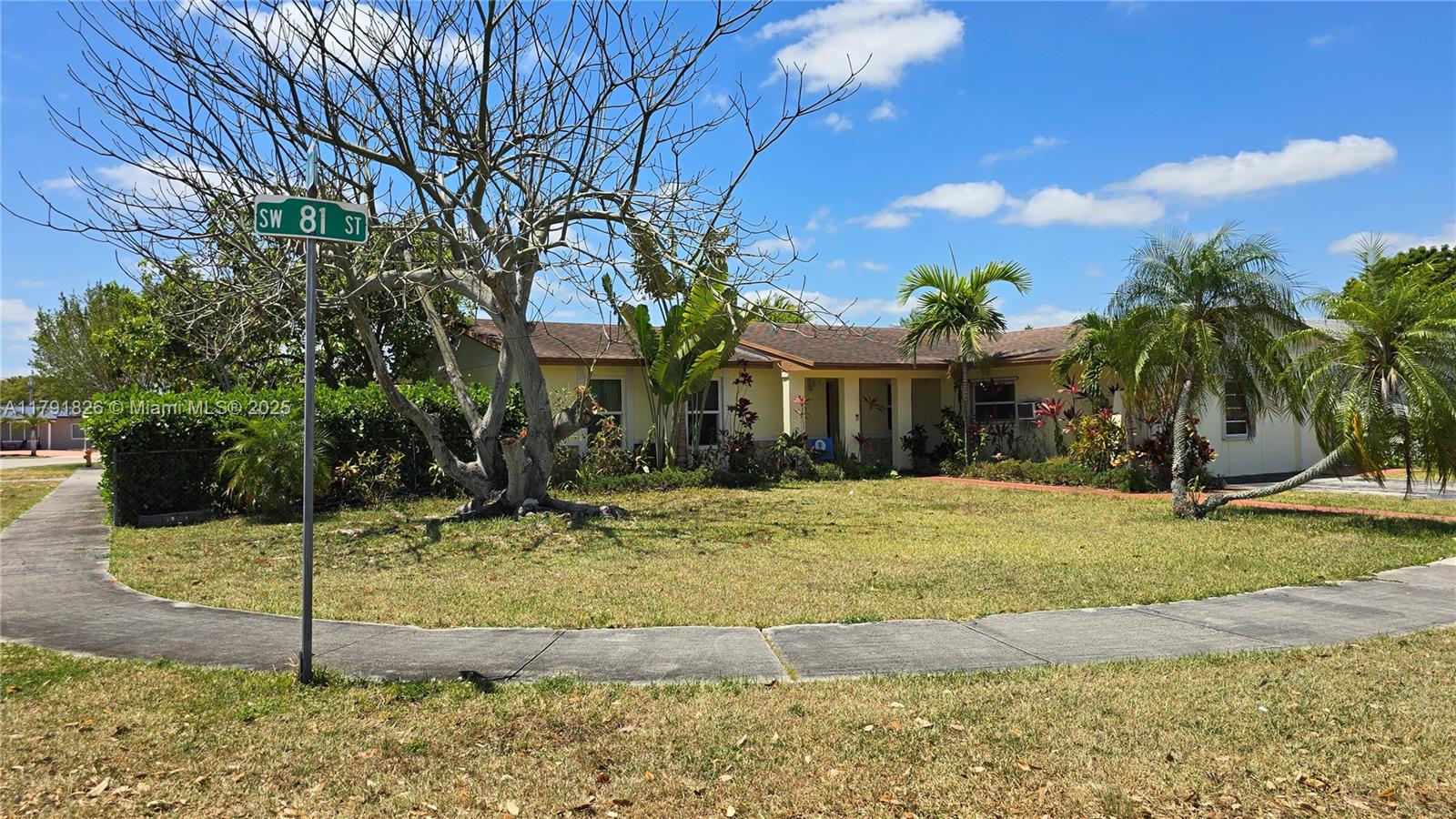 12900 Southwest 81st Street Miami, FL 33183 - Photo 2 of 19 a front view of a house with garden