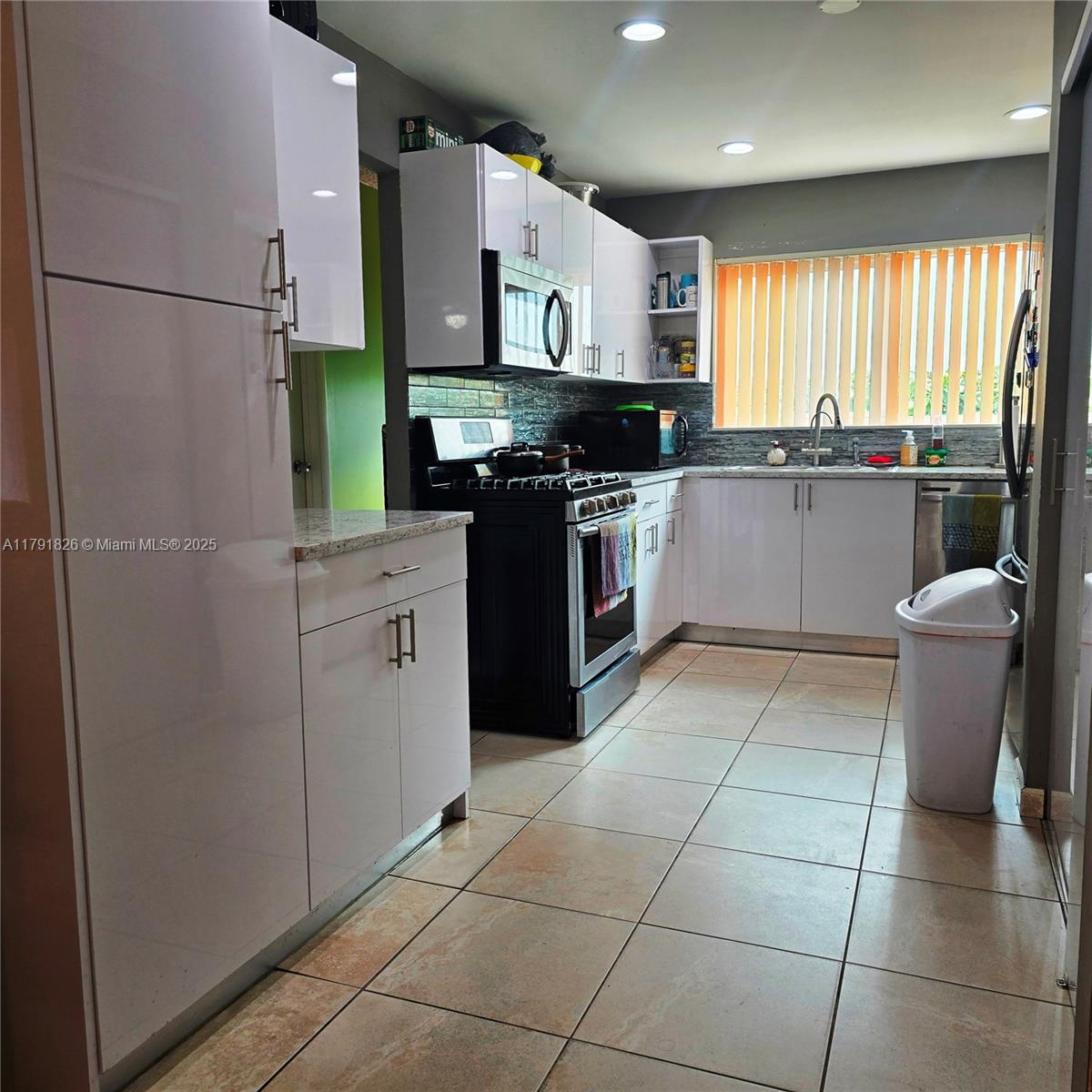 12900 Southwest 81st Street Miami, FL 33183 - Photo 6 of 19 a kitchen with stainless steel appliances granite countertop a refrigerator sink and cabinets