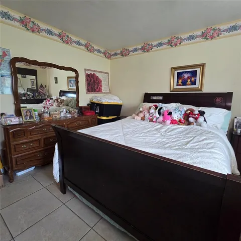 a bedroom with furniture and a bed