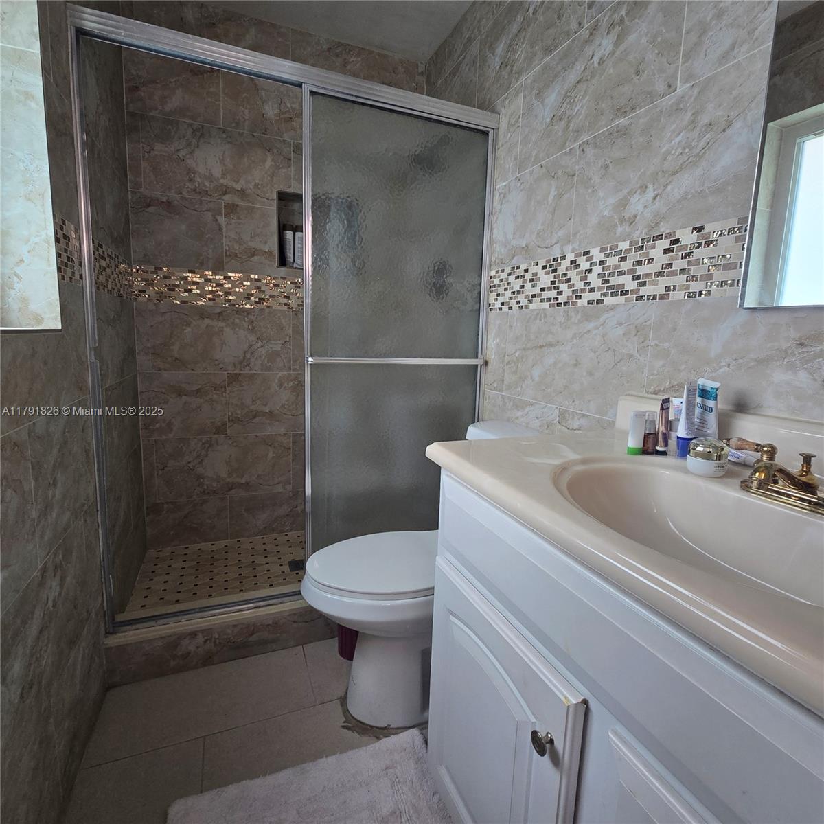 12900 Southwest 81st Street Miami, FL 33183 - Photo 9 of 19 a bathroom with a sink toilet and shower