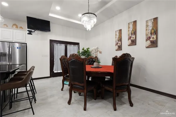 a dining room with furniture and window