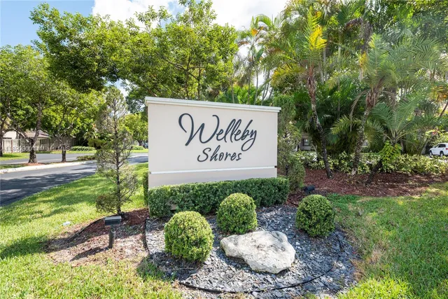 a view of outdoor space with garden and trees