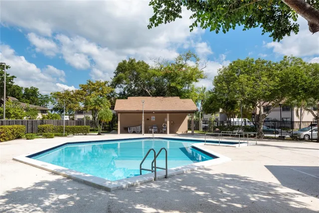 a view of a swimming pool with a patio