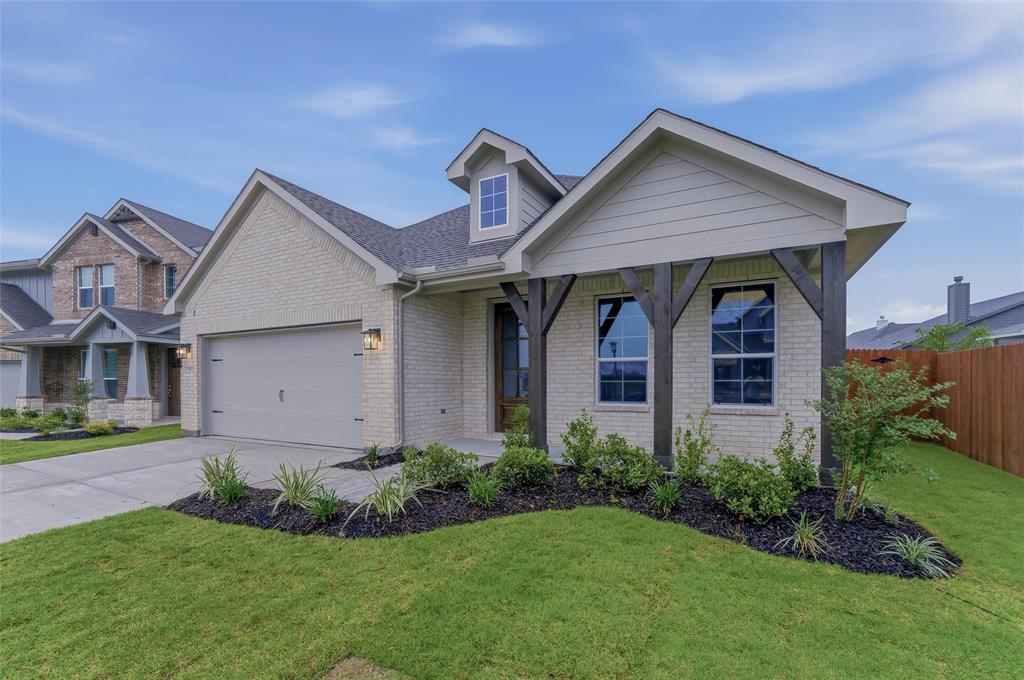 1237 Frio Drive Springtown, TX 76082 - Photo 4 of 25 Single-story residence featuring a light brick facade and a multi-gabled roofline