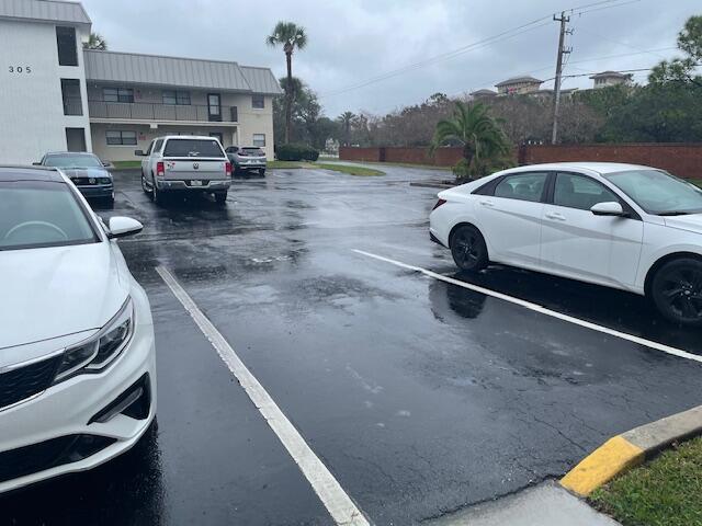 315 Tangle Run Boulevard, Unit 1023 Melbourne, FL 32940 - Photo 15 of 17 a view of a car parked on the road