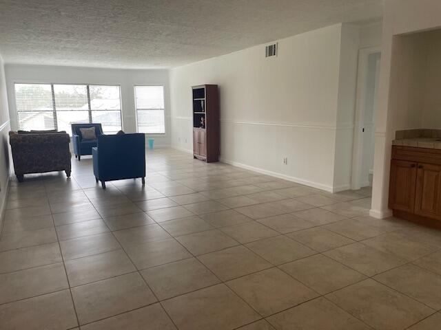 315 Tangle Run Boulevard, Unit 1023 Melbourne, FL 32940 - Photo 17 of 17 a view of a livingroom with furniture and floor to ceiling window